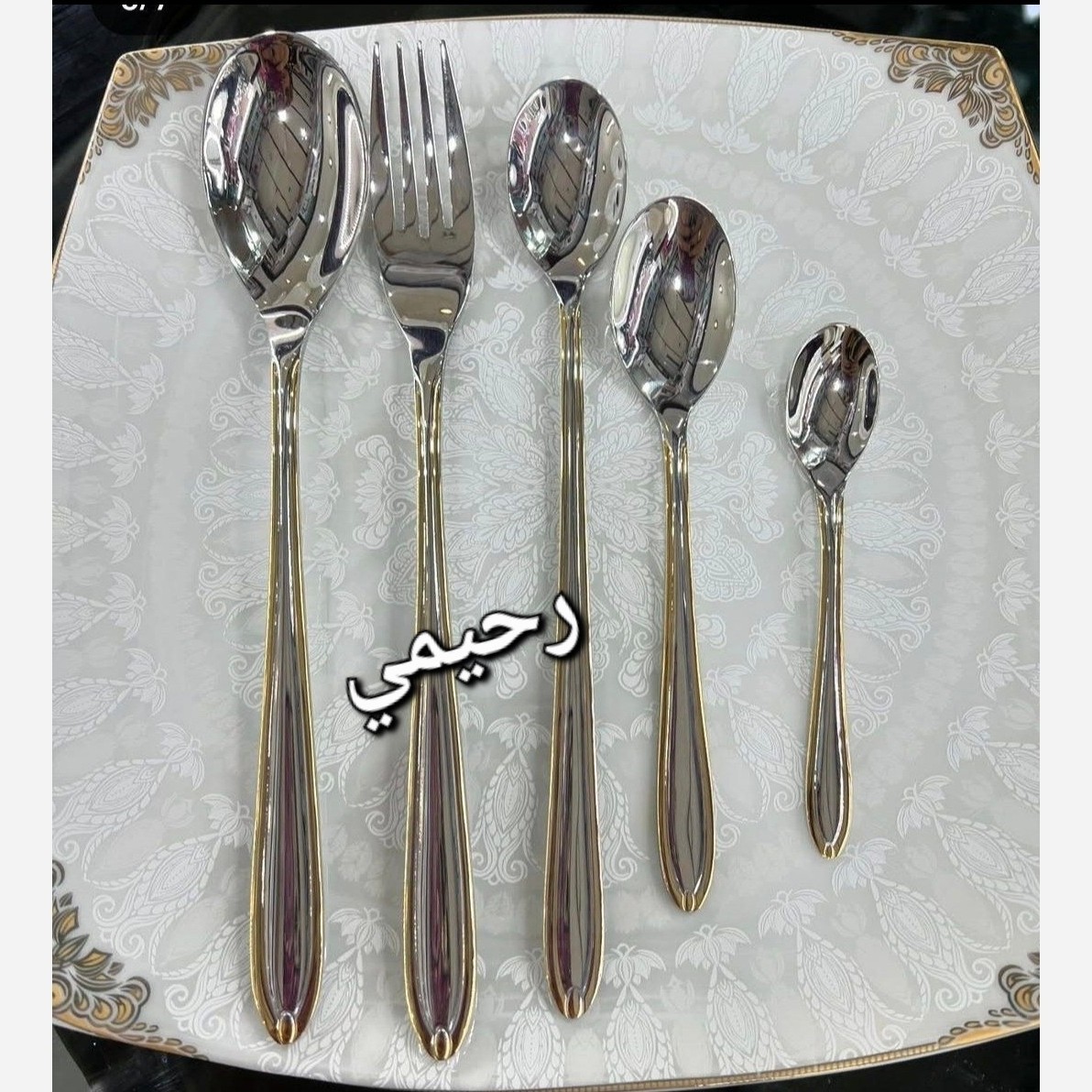 سرویس قاشق و چنگال 24 نفره 120 پارچه یونیک بیچمدان دور نوار طلایی نیمه طلایی